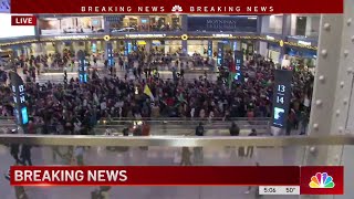 ProPalestinian demonstrators rally inside Penn Stations Moynihan Train Hall  NBC New York [upl. by Ialda492]