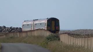 A southbound Transport for Wales train heads towards Tywyn Station Gwynedd CymruWales 26624 [upl. by Gilud]