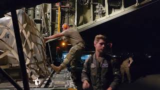 An Air Force Reserve loadmaster and Aerial Port member load a pallet onto a C130H Hercules [upl. by Ymmit]