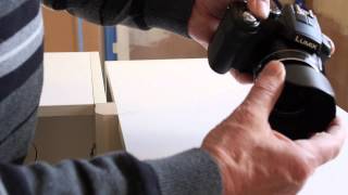 How to install the lens hood on the Panasonic lumix FZ200 [upl. by Bonnibelle]