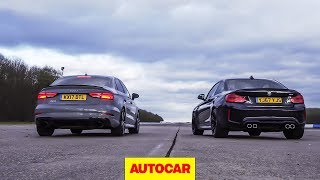 Drag race Audi RS3 vs BMW M2 rolling race  Whats the fastest £50k compact car  Autocar [upl. by Amehr687]