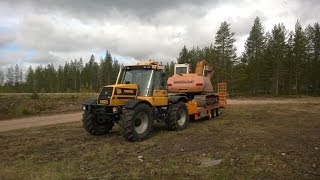 Pulling Samsung excavator with JCB Fastrac 155 [upl. by Indys]