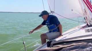 Offshore Sailing School  Adjusting the Fairlead on the Loaded Jib Sheet [upl. by Ahsinrac908]