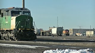 BN SD60M watches BNSF H train with a slow order 30 mph due to a snow plow with the DPU [upl. by Siaht]