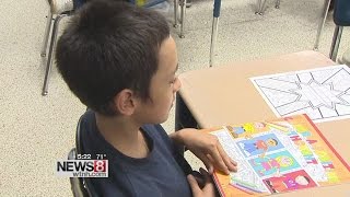 Bridgeport school security officer publishes coloring book to teach about bullying [upl. by Melony832]