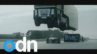 World record stunt Giant truck jumps over speeding Lotus racing car [upl. by Shana942]