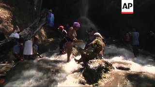 Thousands bathe at sacred waterfall to wash away sins [upl. by Carleen957]