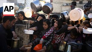 Starving Palestinians in Gaza receive meals from volunteers at start of Ramadan [upl. by Elbertina]