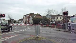 Two trains at Bedhampton level crossing Hampshire [upl. by Deming]