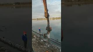 The process of driving cement piles for river cofferdams [upl. by Lord79]