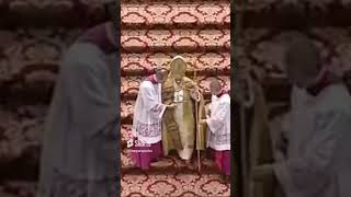 Guido Marini helps Pope Benedict XVI with a cape that is unraveling and falling off his shoulders [upl. by Ynna]