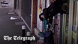 Shopper lifted 6ft into the air after jacket caught on opening shutters [upl. by Fazeli]