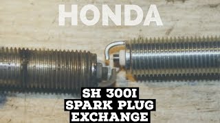 honda SH 300i  spark plug exchange  FMPguides [upl. by Ayekin688]