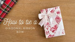 How to tie a diagonal ribbon bow on gift wrapping box [upl. by Egni333]