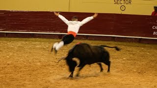 Men jumping over a charging bull  Recortadores [upl. by Temme]