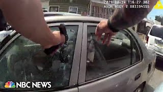 Philadelphia officer charged with murder after bodycam video shows him firing into car [upl. by Gmur]