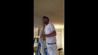 Caulking a ceiling to wall crack before painting [upl. by Nah]