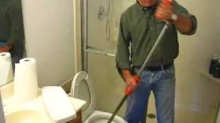 How to Clear a Toilet Clog using a Closet Auger [upl. by Eirod]