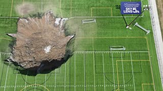 Video shows 100feetwide sinkhole swallowing Illinois soccer field [upl. by Arteid]