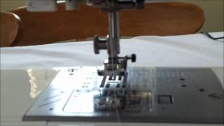 Putting the bobbin in my Janone TXL607 and threading the machine [upl. by Sihonn]