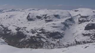 Skiing in summer snowy mountains Røldal Stordalselva  Flying Over Norway [upl. by Trisa]