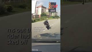 Riderless Motorcycle Swerves into Highway Lane in Malaysia [upl. by Boorer]