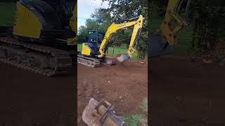 making a lawn yanmar vio55 levelling topsoil [upl. by Ariaet414]