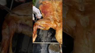 Roasted whole lamb is golden in color carne asado comida delicioso [upl. by Heidt]