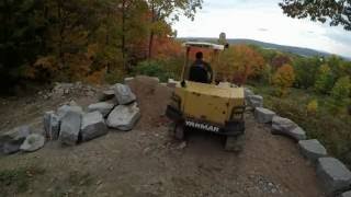 Building a boulder retaining wall [upl. by Ettenauq]