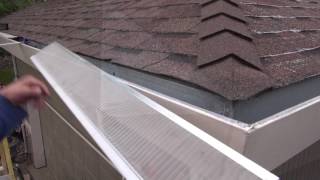 Installing gutter guards on an asphalt shingle roof [upl. by Asillim581]