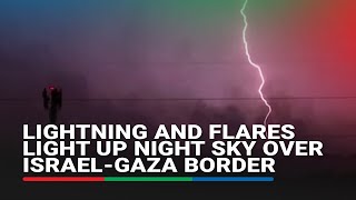 Lightning and flares light up night sky over IsraelGaza border [upl. by Dinesh]