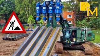 Pile driver pressing massive steel sheet piles into the ground Sennebogen ABI TM18 [upl. by Wiskind]