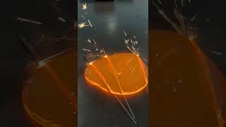 Person pours molten glass over sparklers [upl. by Eenhpad]