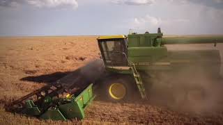 John Deere 8820 combine and John Deere 7700 combine harvesting wheat together June 2024 [upl. by Jillana489]