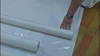 Wholesale based painters apply felt backing adhesive between subfloor [upl. by Finley]