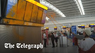 Just Stop Oil protesters spray Heathrow Airport [upl. by Clarissa]