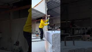 A worker stands on a forklift and splits stone into slabs [upl. by Lirba17]