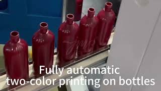 Fully automatic two color printing on bottles screenprinter screenprintingmachine hotstamping [upl. by Eibor]