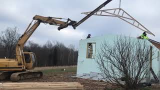 Setting trusses with John deere120 using homemade excavator attachment dirtperfect [upl. by Chryste]