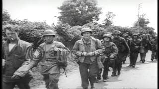 French civilians greet US Army entering SainteMarieduMont during World WarHD Stock Footage [upl. by Nnylram177]