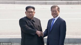 Moon Kim shake hands at Panmunjom [upl. by Nav]