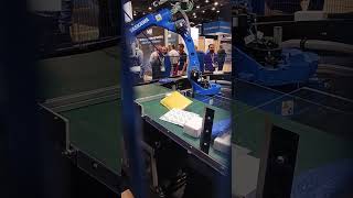 Automate 2024 Demo Robotic parcel induction workcell uses highspeed GP12 robot automate2024 [upl. by Malin]