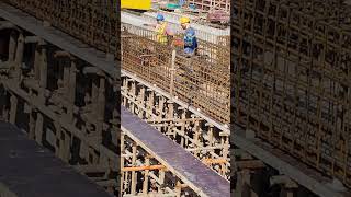 Workers try to put second layer of rebar for girder beam [upl. by Yllet]