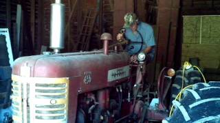 Starting up 1957 IH Farmall D450 diesel tractor [upl. by Sivek]