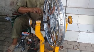 How to spoke a motorcycle wheel [upl. by Enirac]