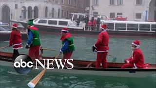 Santas swap sleighs for gondolas in Venice Christmas regatta l ABC News [upl. by Yarised]