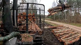 John Deere 1010G Unloading pulpwood [upl. by Pincince921]