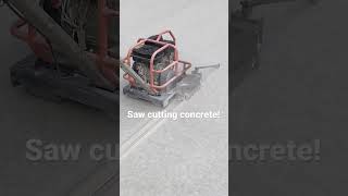 Saw cutting concrete with a soffcut saw [upl. by Ahseat]