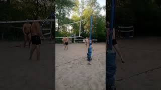 Beach volleyball a sharp hit of the ball under the net [upl. by Airenahs]