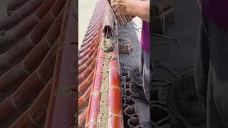 The cement mortar fixing process of red glazed tiles on the roof [upl. by Norvun]